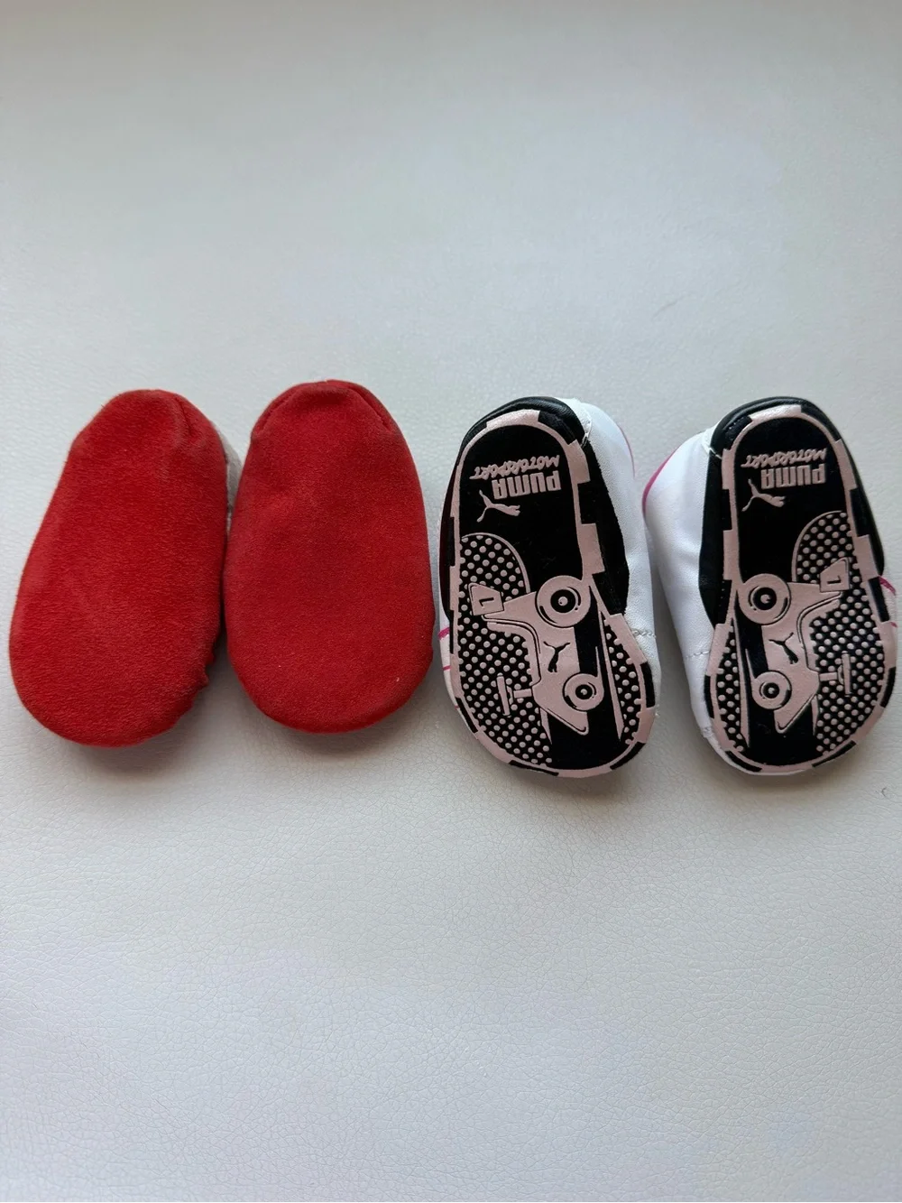 Puma White/ Pink Infant Slip-On Sneakers and brown baby moccasins with orange